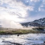 Hot spring with grass and mountain